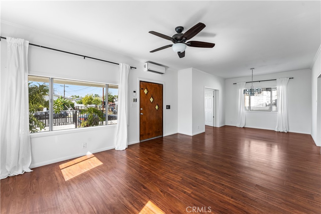 1178 Spence Street Los Angeles, CA 90023 - Photo 27 of 36 a view of empty room with wooden floor and fan
