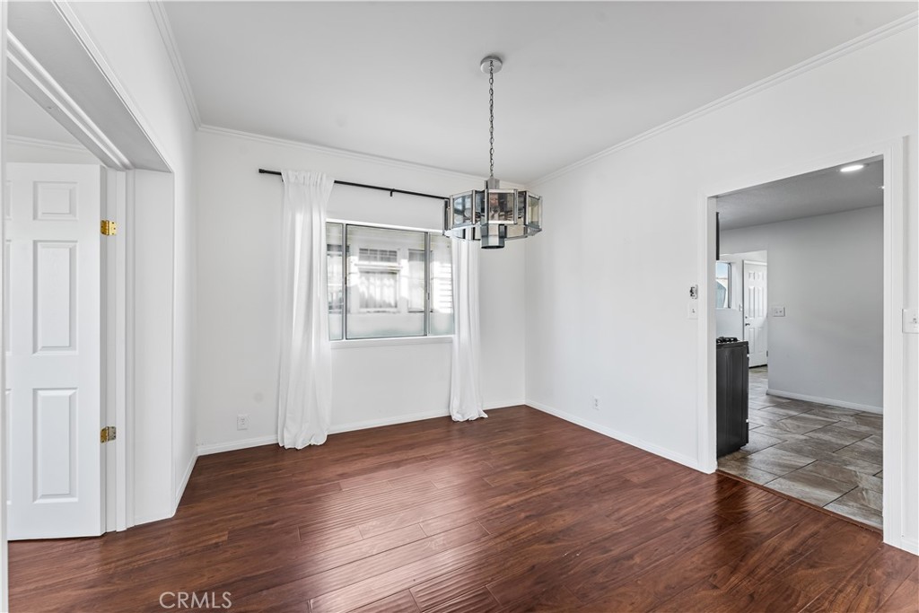 1178 Spence Street Los Angeles, CA 90023 - Photo 28 of 36 a view of empty room with wooden floor