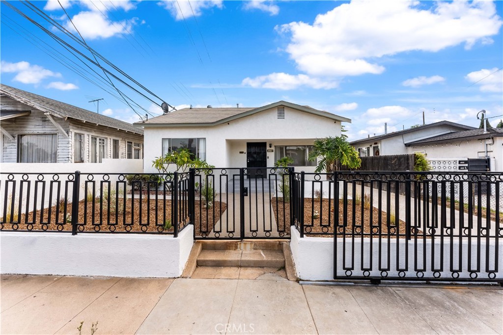 1178 Spence Street Los Angeles, CA 90023 - Photo 36 of 36 a front view of a house with a garden
