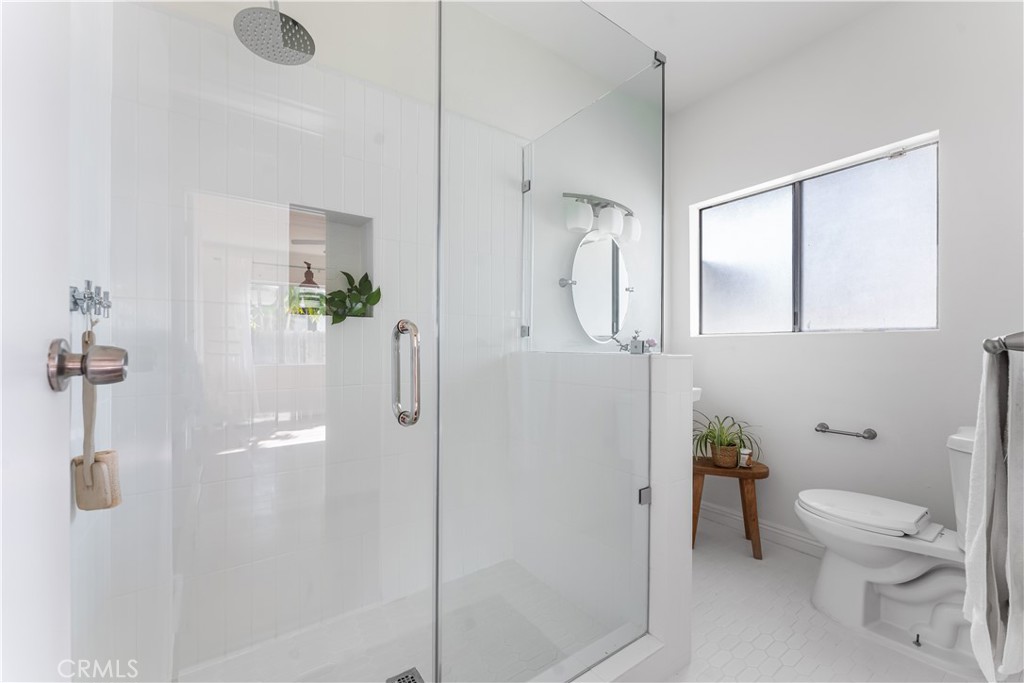 1178 Spence Street Los Angeles, CA 90023 - Photo 6 of 36 a white toilet sitting next to a bathroom sink