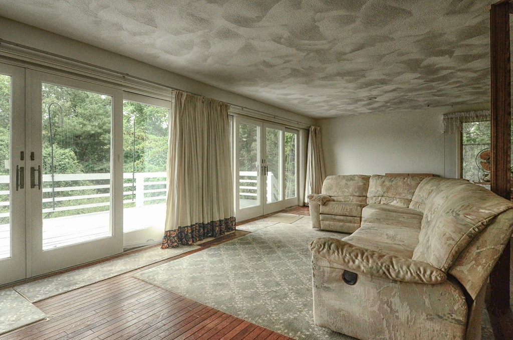 4 Pinewood Road Wareham, MA 02532 - Photo 11 of 30 a living room with furniture and large windows