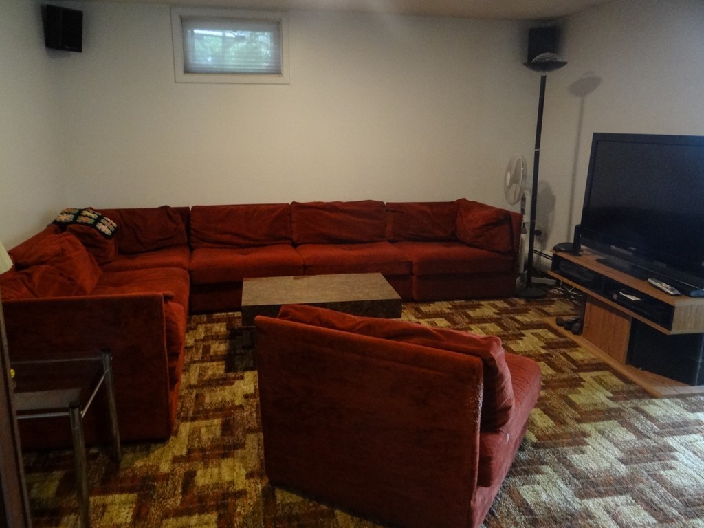 4 Pinewood Road Wareham, MA 02532 - Photo 20 of 30 a living room with a couch and a flat screen tv