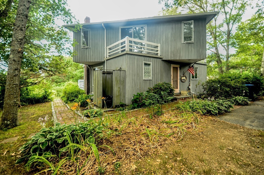 4 Pinewood Road Wareham, MA 02532 - Photo 22 of 30 a view of a house with a yard and plants