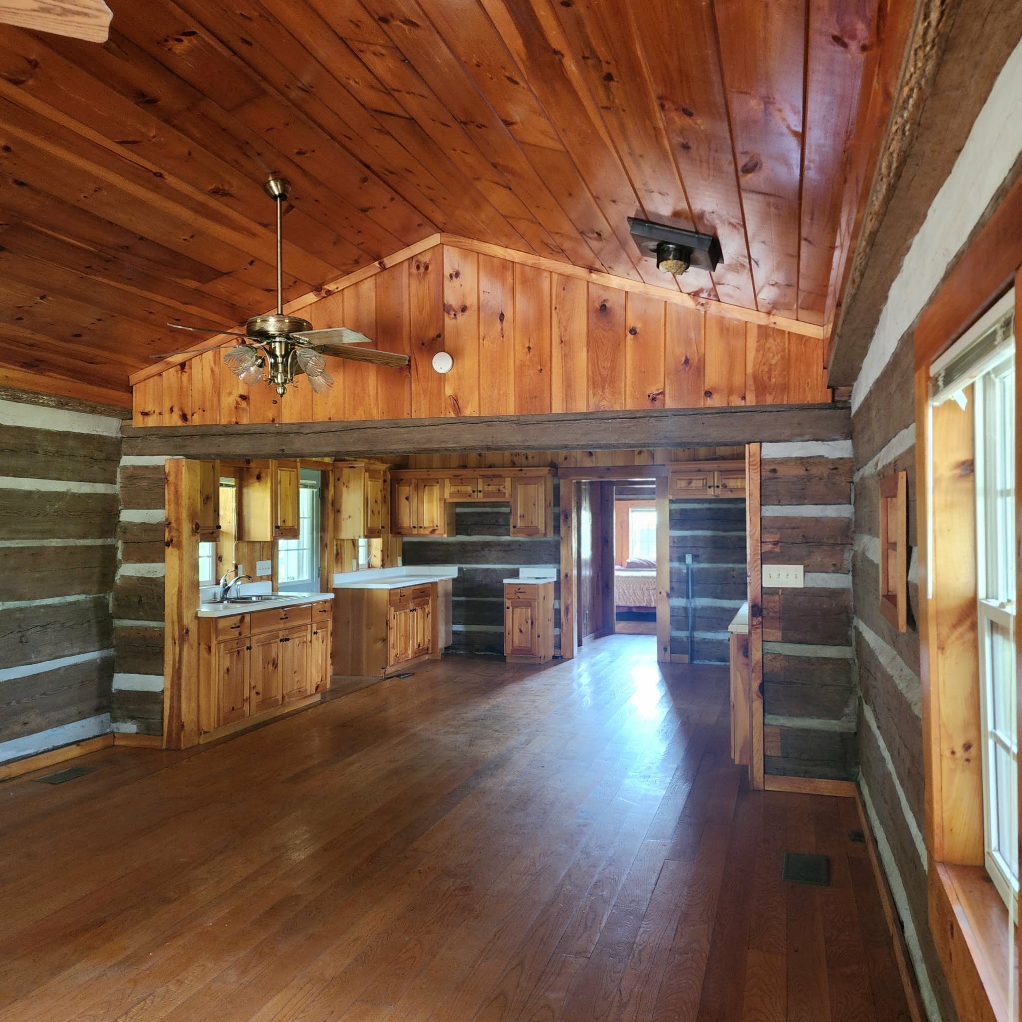 145 Mrs Gower Road Lawrenceburg, TN 38464 - Photo 11 of 26 a living room with fireplace furniture and a wooden floor