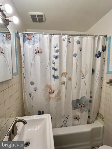 a bathroom with a sink and a shower