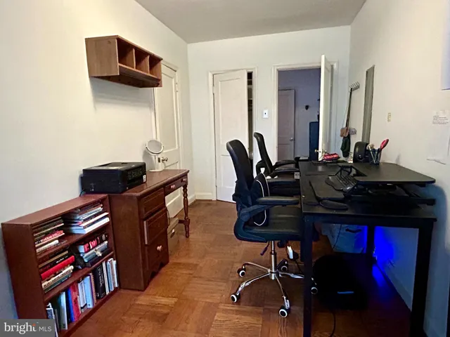 a view of a workspace with furniture