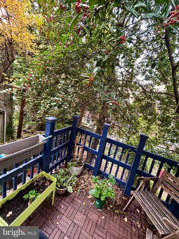 a wooden bench sitting in front of a building