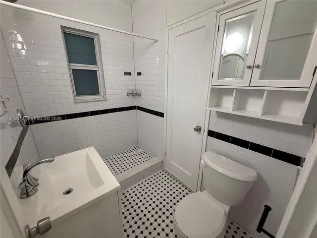 a bathroom with a sink and toilet