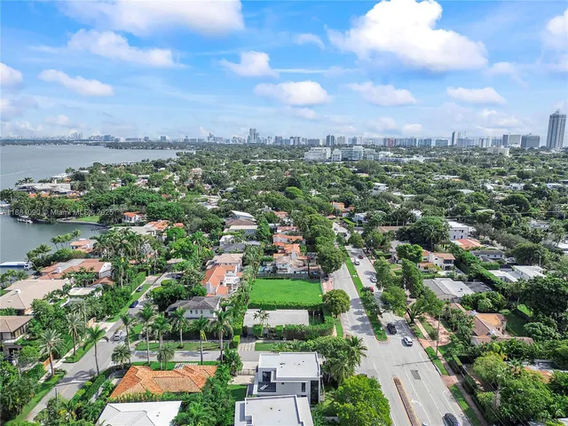 a view of house with backyard outdoor seating and green space