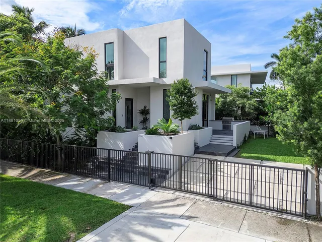 a kitchen with a sink and a wooden floor