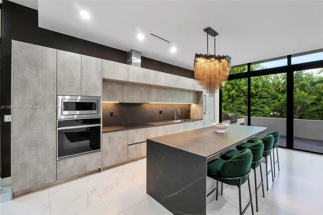a kitchen with a table and chairs in it