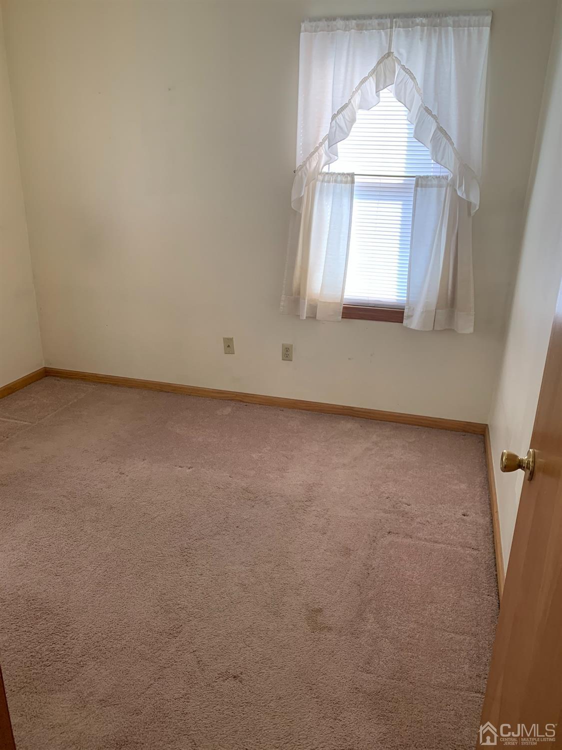 138 Rector Street Perth Amboy, NJ 08861 - Photo 12 of 15 an empty room with a window