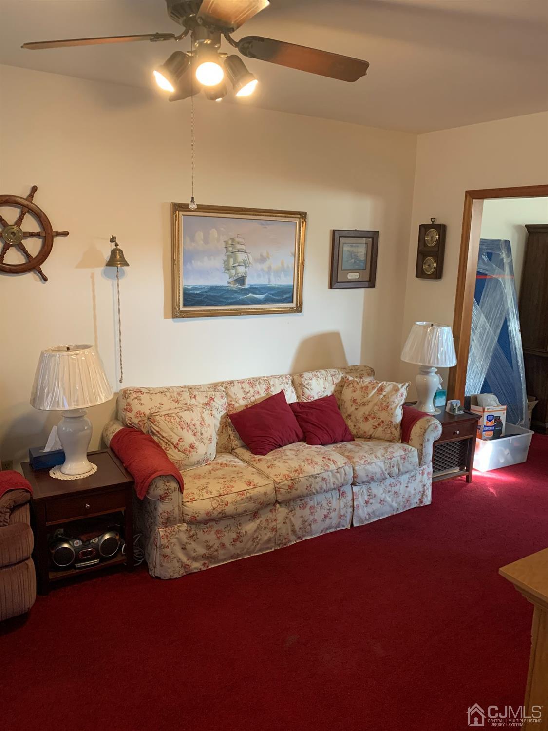 138 Rector Street Perth Amboy, NJ 08861 - Photo 3 of 15 a living room with furniture and a flat screen tv