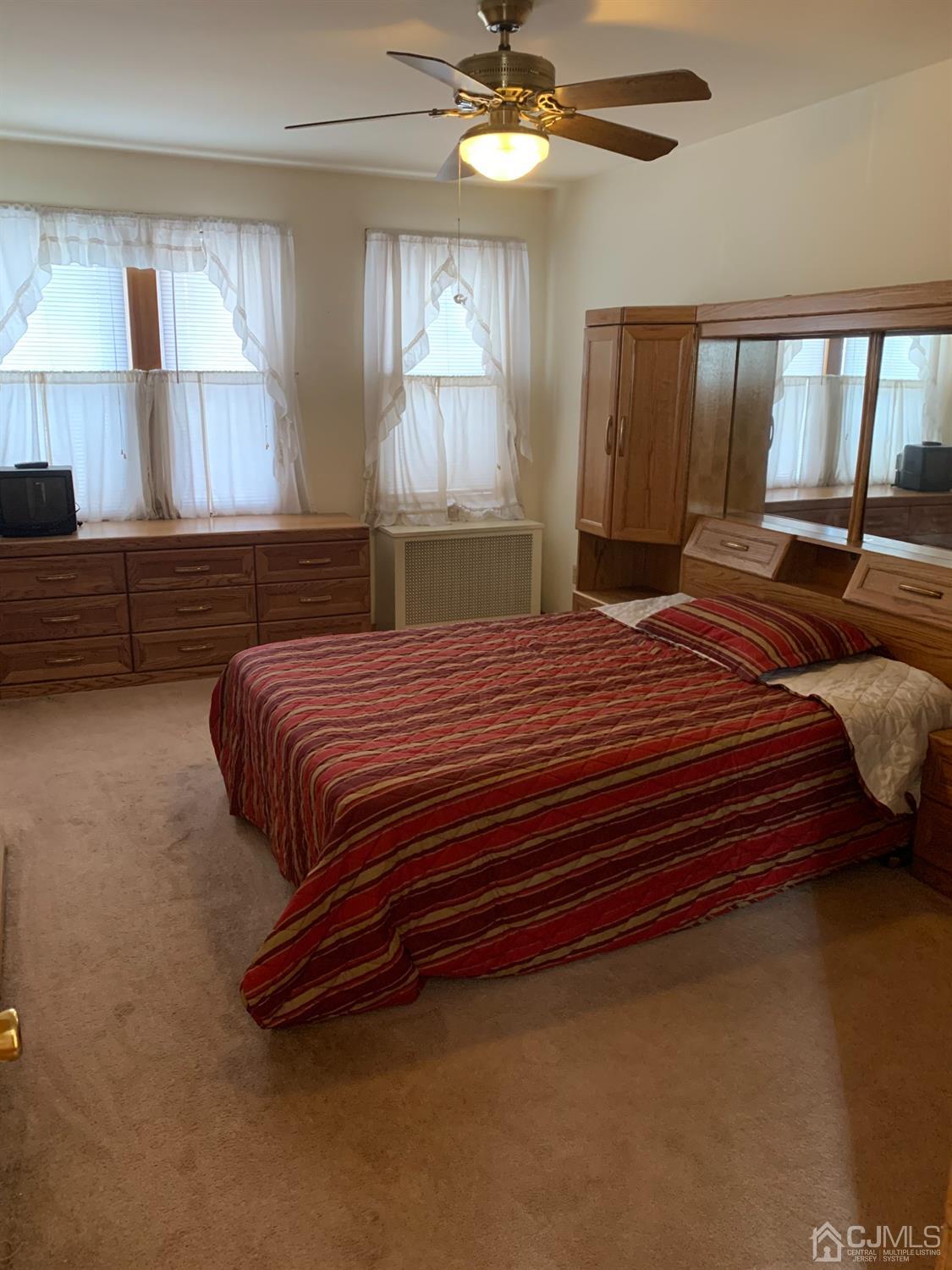 138 Rector Street Perth Amboy, NJ 08861 - Photo 9 of 15 a bedroom with a bed and window