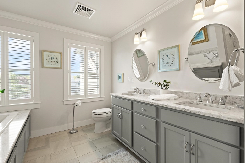 14 Parkview Road, Unit 14 Franklin, MA 02038 - Photo 27 of 42 a bathroom with a toilet a sink a mirror a and window