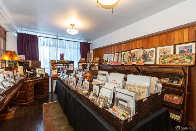 a view of a kitchen with kitchen island granite countertop a large window and a counter space