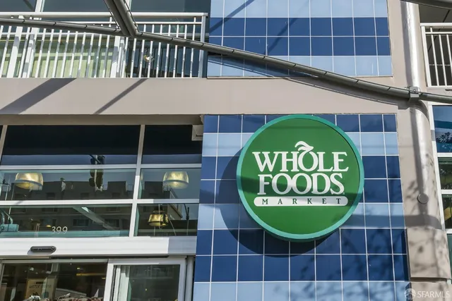 a glass window with glass top table and chairs