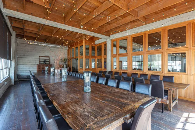 a dining room with furniture window and wooden floor