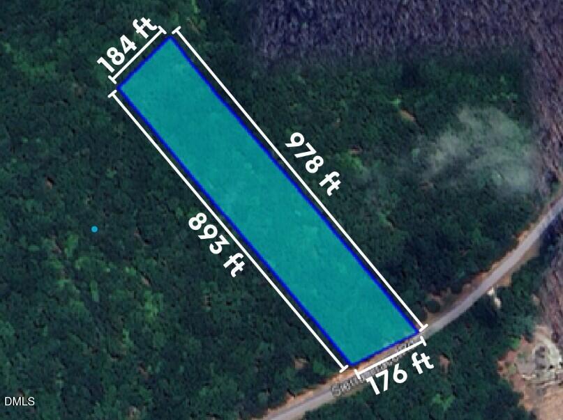 1661 Sierra Trace Road Denton, NC 27239 - Photo 2 of 4 a green field with lots of trees in the background