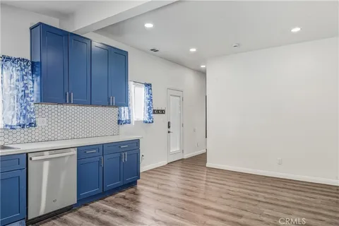 a kitchen with wooden cabinets and sink