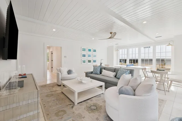a view of a chair and table on the roof deck