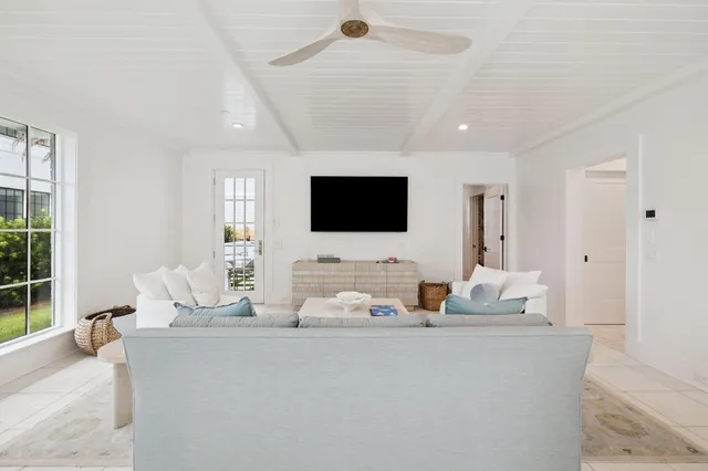 a bathroom with a granite countertop double vanity sink and a mirror