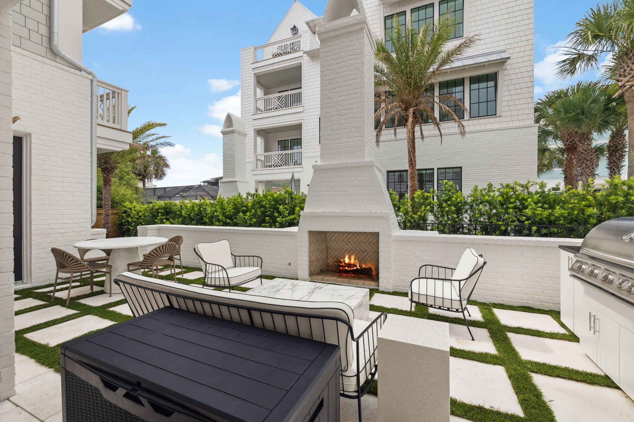 8978 East County Highway Inlet Beach, FL 32461 - Photo 30 of 118 a view of a patio with couches table and chairs and potted plants