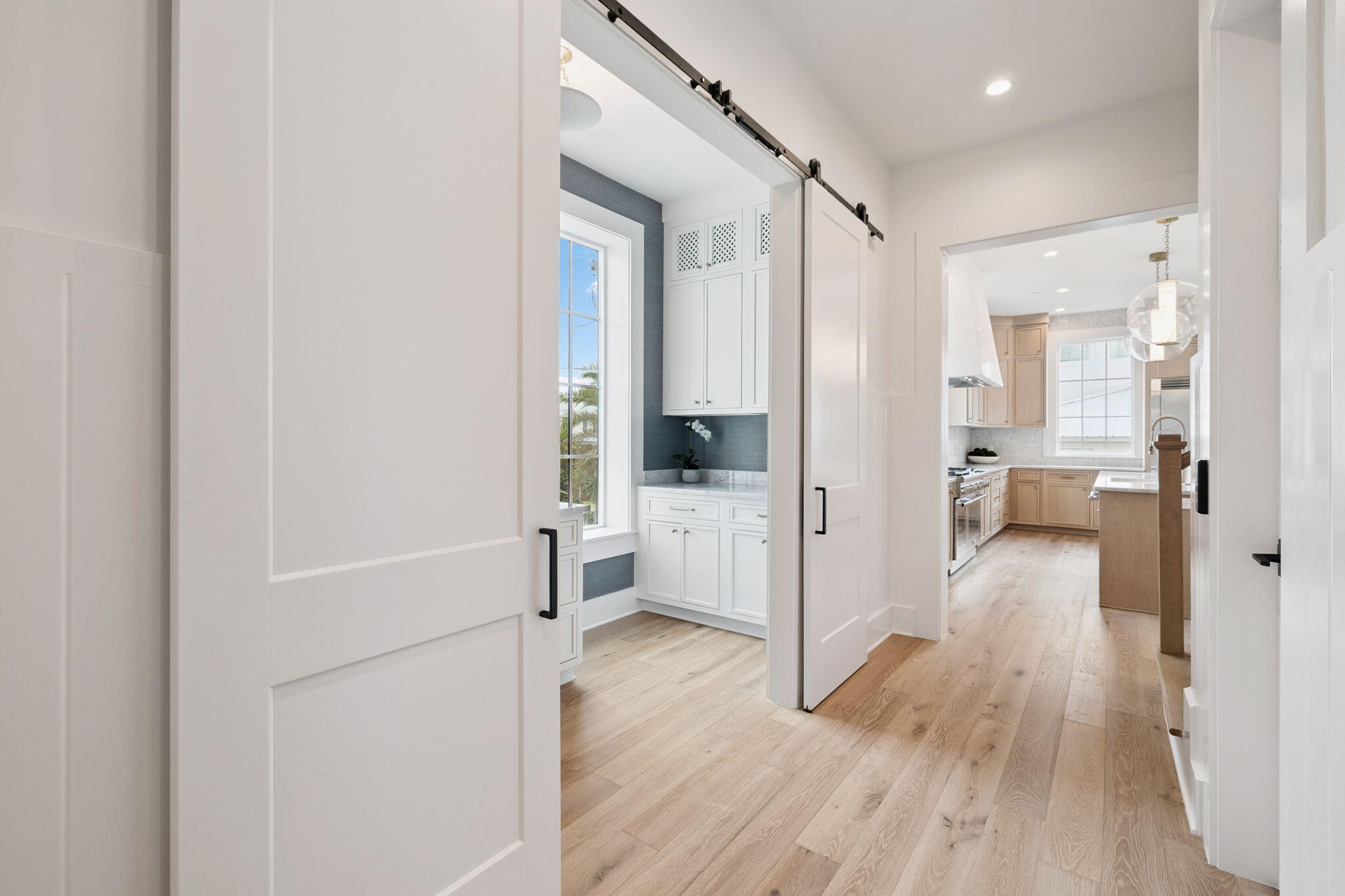 8978 East County Highway Inlet Beach, FL 32461 - Photo 33 of 118 a view of a hallway with wooden floor a glass door and a bathroom