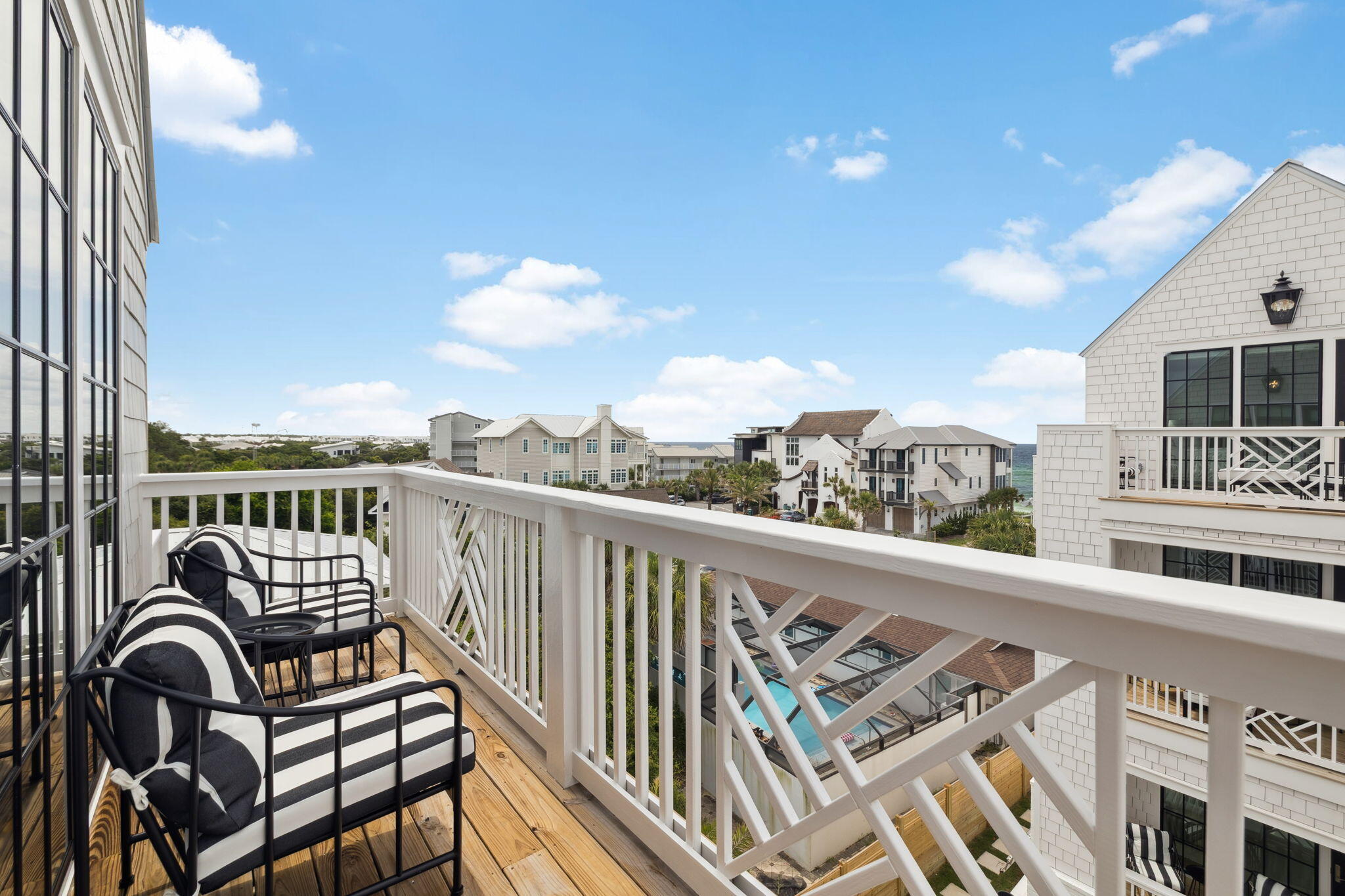 8978 East County Highway Inlet Beach, FL 32461 - Photo 97 of 116 a view of a balcony with wooden chairs
