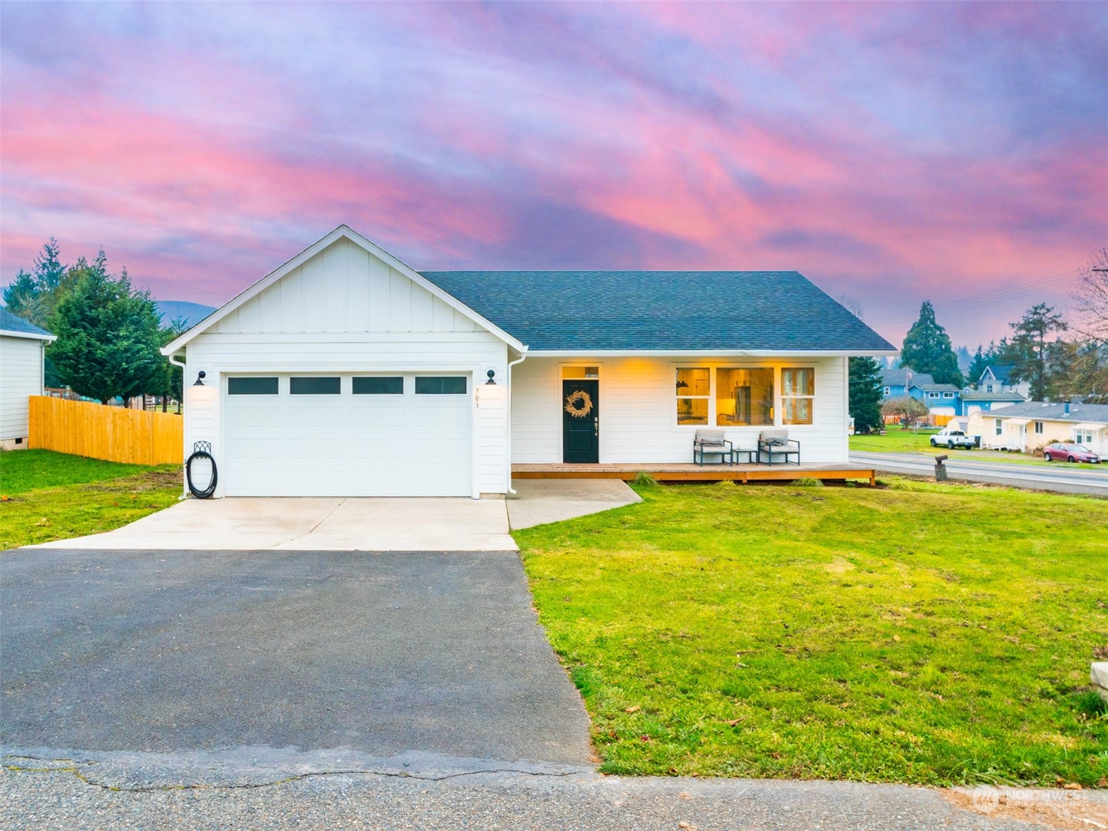 703 D Street Vader, WA 98593 - Photo 1 of 39 a front view of a house with a yard and garage