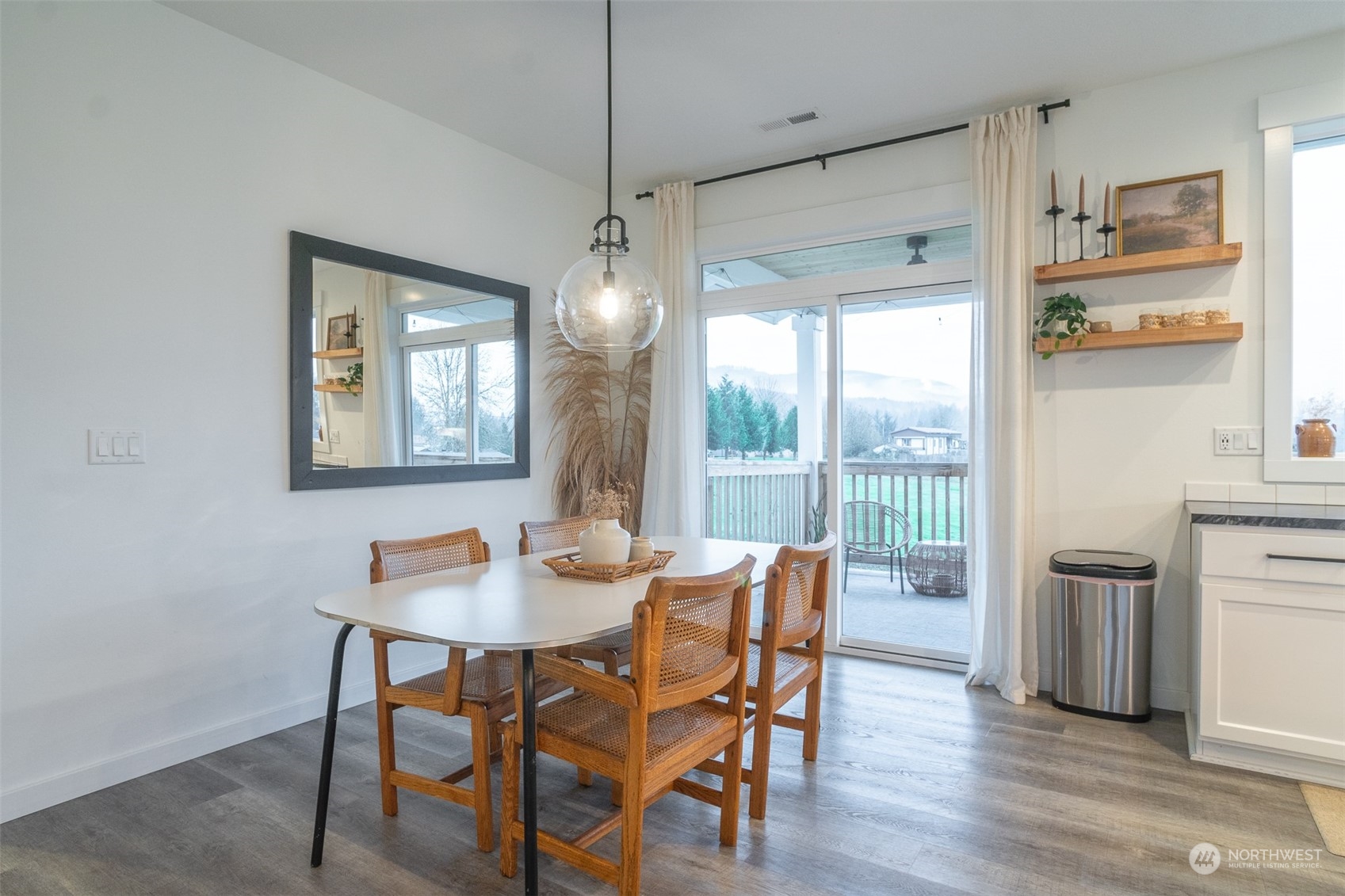 703 D Street Vader, WA 98593 - Photo 11 of 39 a view of a dining room with furniture window and wooden floor