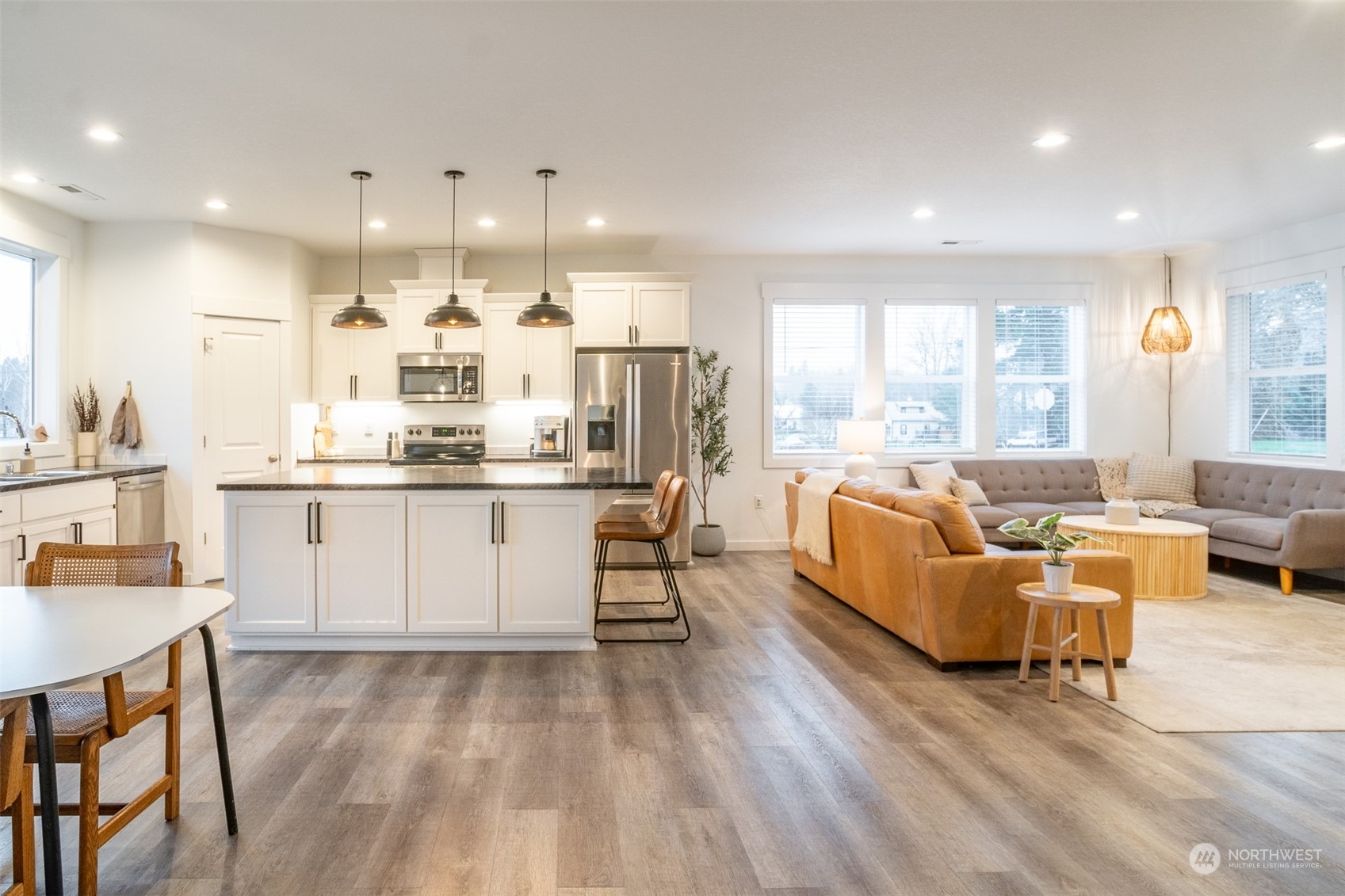 703 D Street Vader, WA 98593 - Photo 15 of 39 a living room with kitchen island furniture and a large window