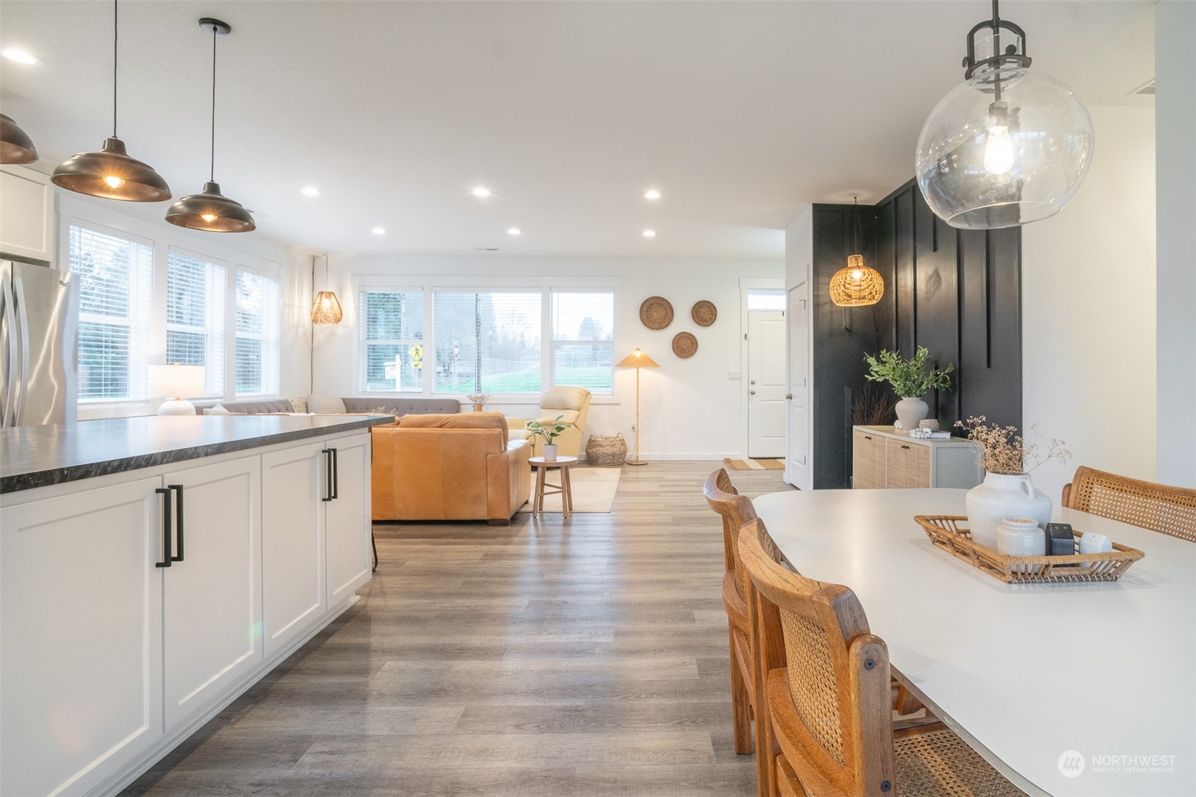 703 D Street Vader, WA 98593 - Photo 19 of 39 a large kitchen with kitchen island white cabinets and a chandelier