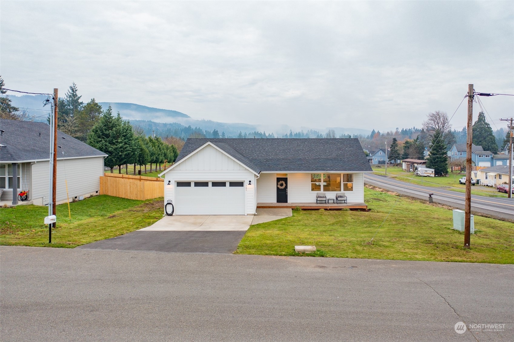703 D Street Vader, WA 98593 - Photo 2 of 39 a house view with a garden space