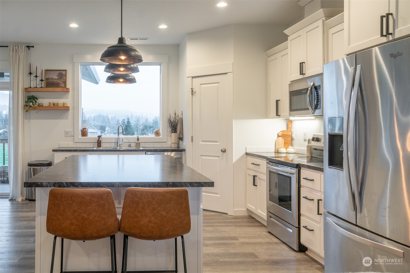 703 D Street Vader, WA 98593 - Photo 23 of 39 a kitchen with stainless steel appliances granite countertop a refrigerator a stove and a sink