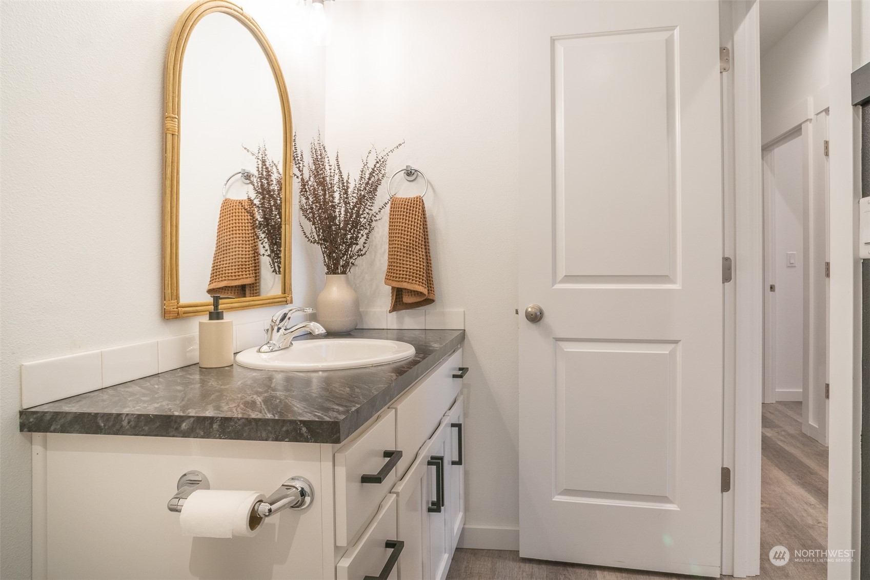 703 D Street Vader, WA 98593 - Photo 30 of 39 a bathroom with a granite countertop sink and a mirror