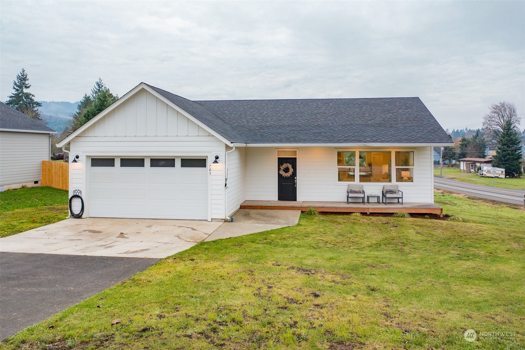 703 D Street Vader, WA 98593 - Photo 3 of 39 a front view of house with yard and swimming pool