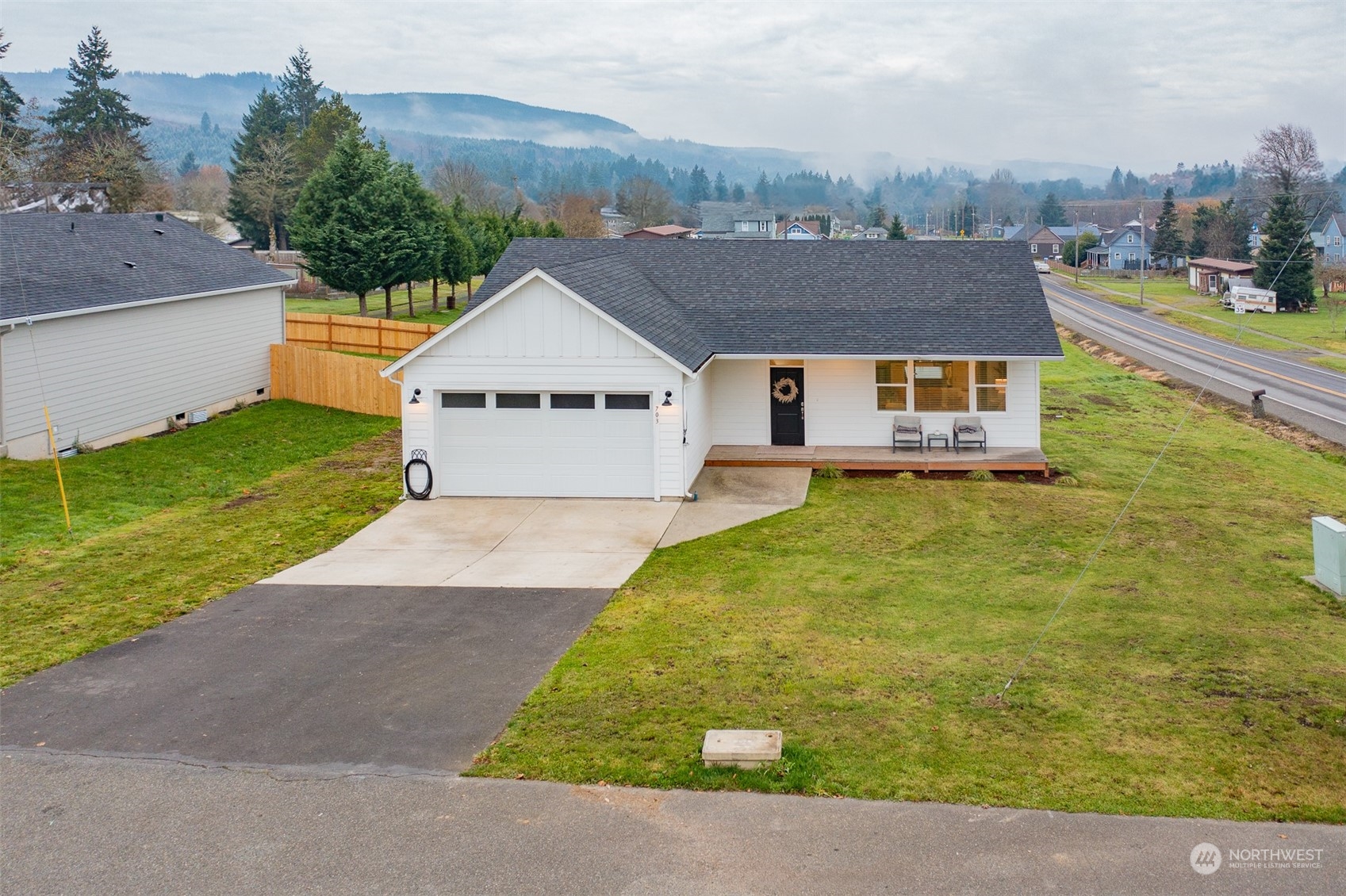 703 D Street Vader, WA 98593 - Photo 4 of 39 an aerial view of a house with a garden and a yard
