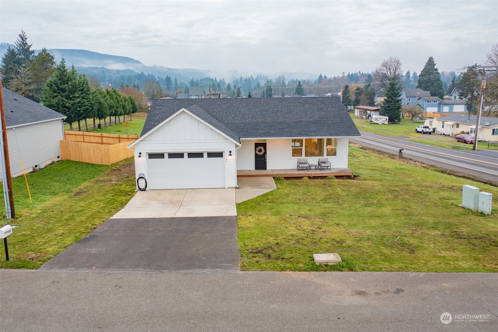 703 D Street Vader, WA 98593 - Photo 5 of 39 a aerial view of a house with a yard and a large tree