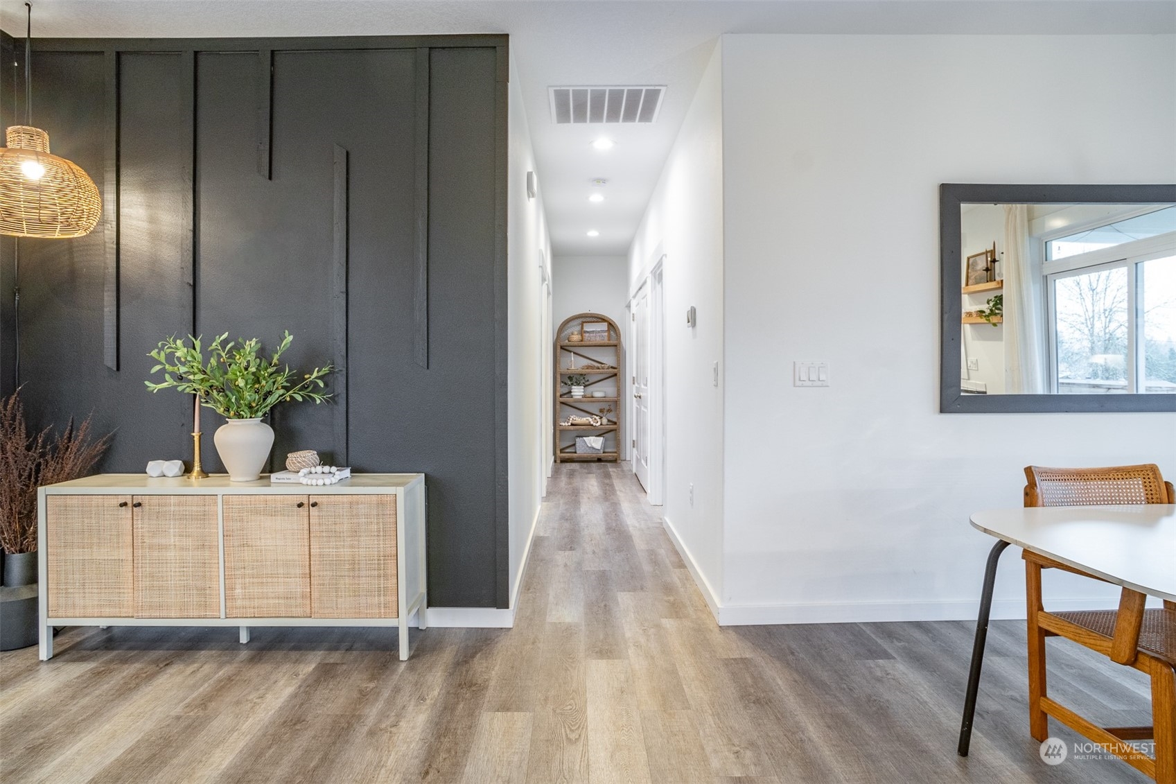 703 D Street Vader, WA 98593 - Photo 10 of 39 a view of a hallway to a livingroom with furniture