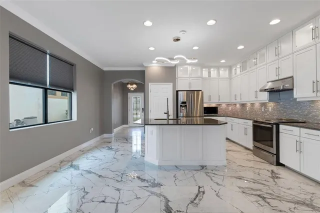 a living room with furniture and large window