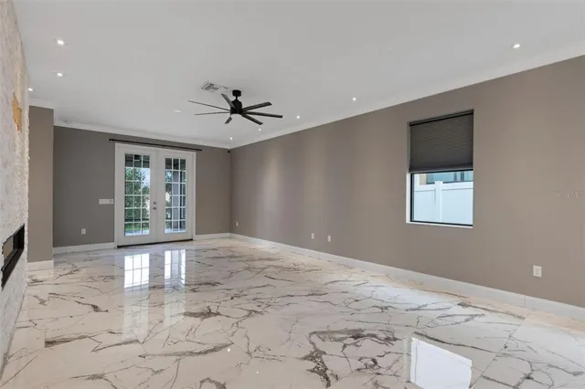 a view of an empty room and a window