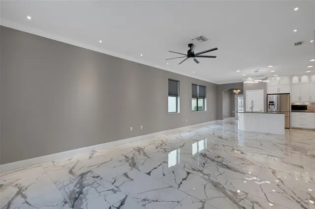 a bathroom with a double vanity sink mirror and shower
