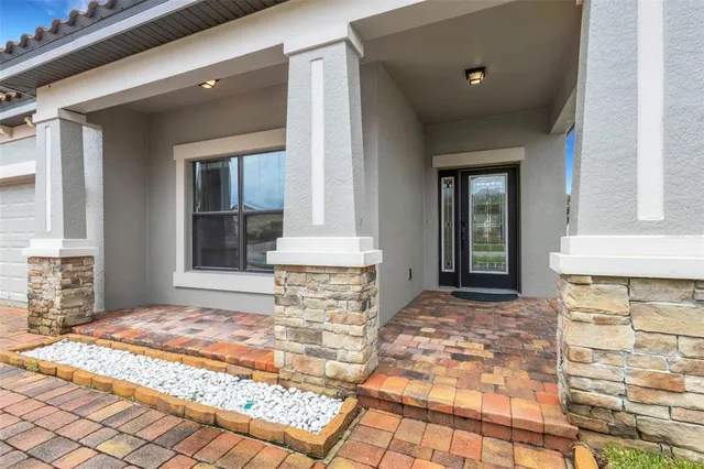 a view of wooden floor and windows in a room