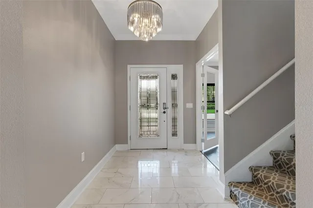 a view of a workspace with furniture and a bookshelf
