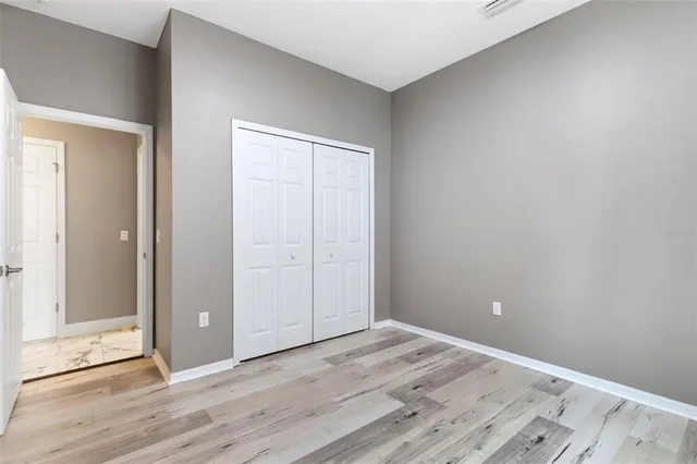 an aerial view of residential houses with outdoor space and street view