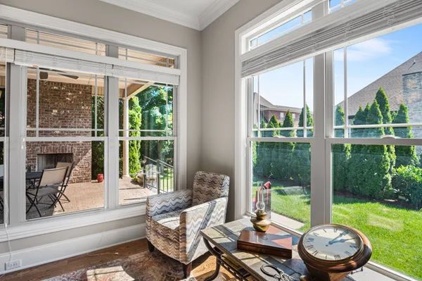 a living room with a large window and a yard