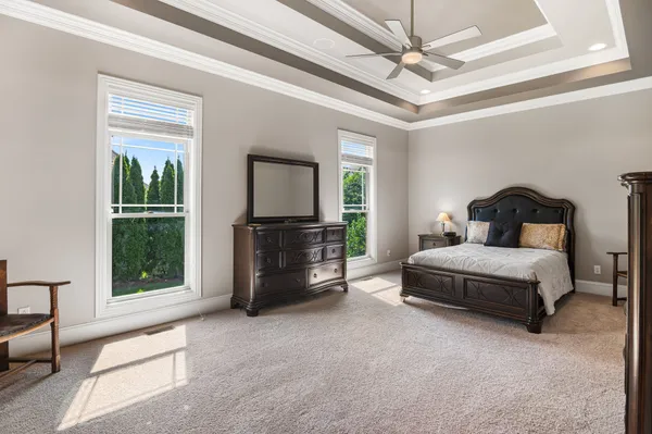 a bedroom with a bed closet and flat tv screen