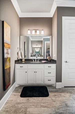 a bathroom with a sink and a mirror