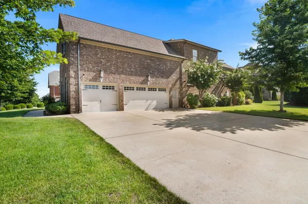 a view of a building with a yard